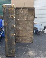 Trunk open showing drawers and lining