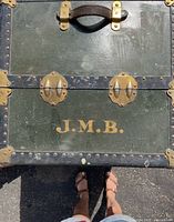 Front view showing green panels, brass hardware, initials J.M.B.