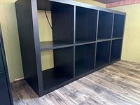 Front view of black-brown eight-cube bookcase