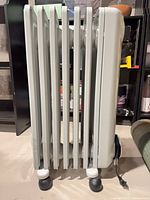 Side view showing oil-filled fins and casters