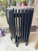 Full side view showing six fins, wheels and overall condition