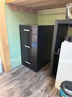 Front angled view showing three drawers, handles, and lock