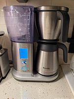 Front view of Breville Precision Brewer with water tank and thermal carafe