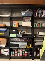 Close view of one bookcase section with shelves and contents