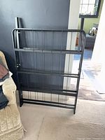 Frame folded upright showing head/foot section