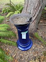 Full view of birdbath assembled under tree