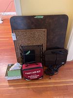 Full view of lot including card table, bags, bins, cords