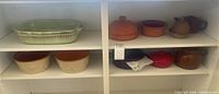 Shelf overview showing all ceramic cookware pieces