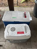 Two coolers stacked together, showing sizes and colors