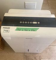 Front and top view of Danby dehumidifier showing control panel and size label