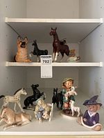 All figurines arranged on shelf