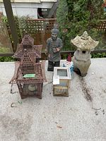 Group shot of five garden décor items on patio