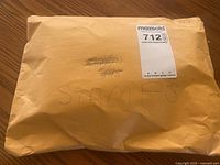 Closed manila envelope labelled Stamps