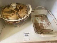 Both pottery pieces together showing design and lot number