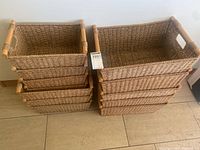 Front view of two stacks of woven baskets showing quantity and style