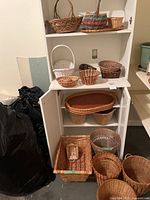 Overview of shelving unit with multiple baskets on and around it