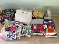 Group shot of all bedding, towels, and hairdryer