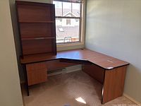 Full view of L-shaped desk with hutch attached