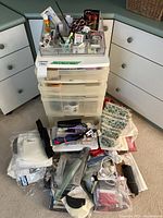 Overall lot showing drawer unit, organizer tray and assorted supplies on floor