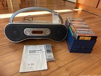 Full lot: boombox, remote, manual, box of CDs
