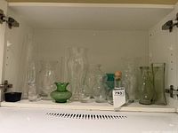 All vases lined inside cabinet