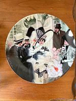 Front of plate showing artwork scene