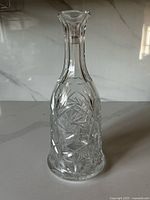 full view of clear pinwheel cut crystal decanter bottle without stopper