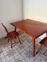 Table and two chairs full view