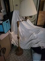 Full view of floor lamp with shade showing design and height