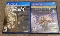 Front view of both PS4 game cases: Fallout 4 and Destiny The Taken King