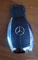 Front view showing Mercedes-Benz emblem and button layout