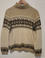 Front view of beige Fair Isle turtleneck sweater
