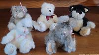Group shot of five posable teddy bears