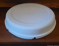 Closed Tupperware serving center set showing full cover lid