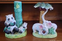 Front view of panda and elephant ceramic planters