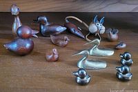 Full group view showing all wooden, brass and metal animal miniatures