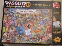 Closed box top showing artwork, title, piece count