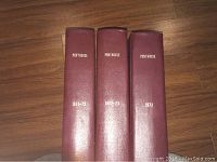 Three burgundy bound Penthouse volumes on wooden floor showing years 1971-72, 1972-73, and 1973 embossed on spine in gold.