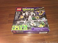 Front view of sealed LEGO Teenage Mutant Ninja Turtles Battle Robot set 79105 box, showing piece count and recommended ages.