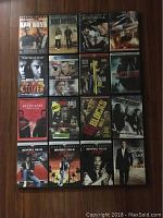 Photo of 16 action movie DVDs arranged in a 4x4 grid highlighting titles and cover art.
