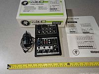 Mixer, power adapter, box, manuals, tape measure for scale