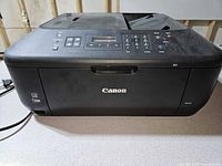 Front view of Canon PIXMA MX452 showing control panel and exterior condition