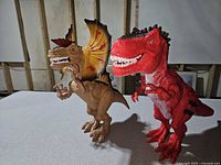 Front view of both dinosaur toys