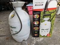 Entire sprayer with hose and box visible