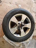 Full view of one wheel with tire and rim