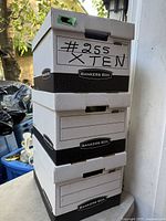 Stack of three of the ten Bankers Box storage boxes showing branding, lids, and size