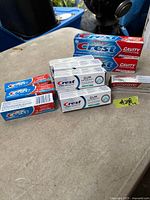 Group showing large, travel and kid’s Crest toothpaste boxes