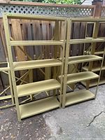 Pair of metal shelving units with five shelves each