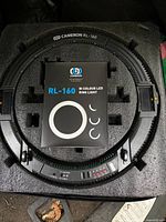 Ring light in protective foam with instruction booklet