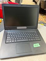 Open Dell Inspiron 3482 laptop showing screen, keyboard and touchpad